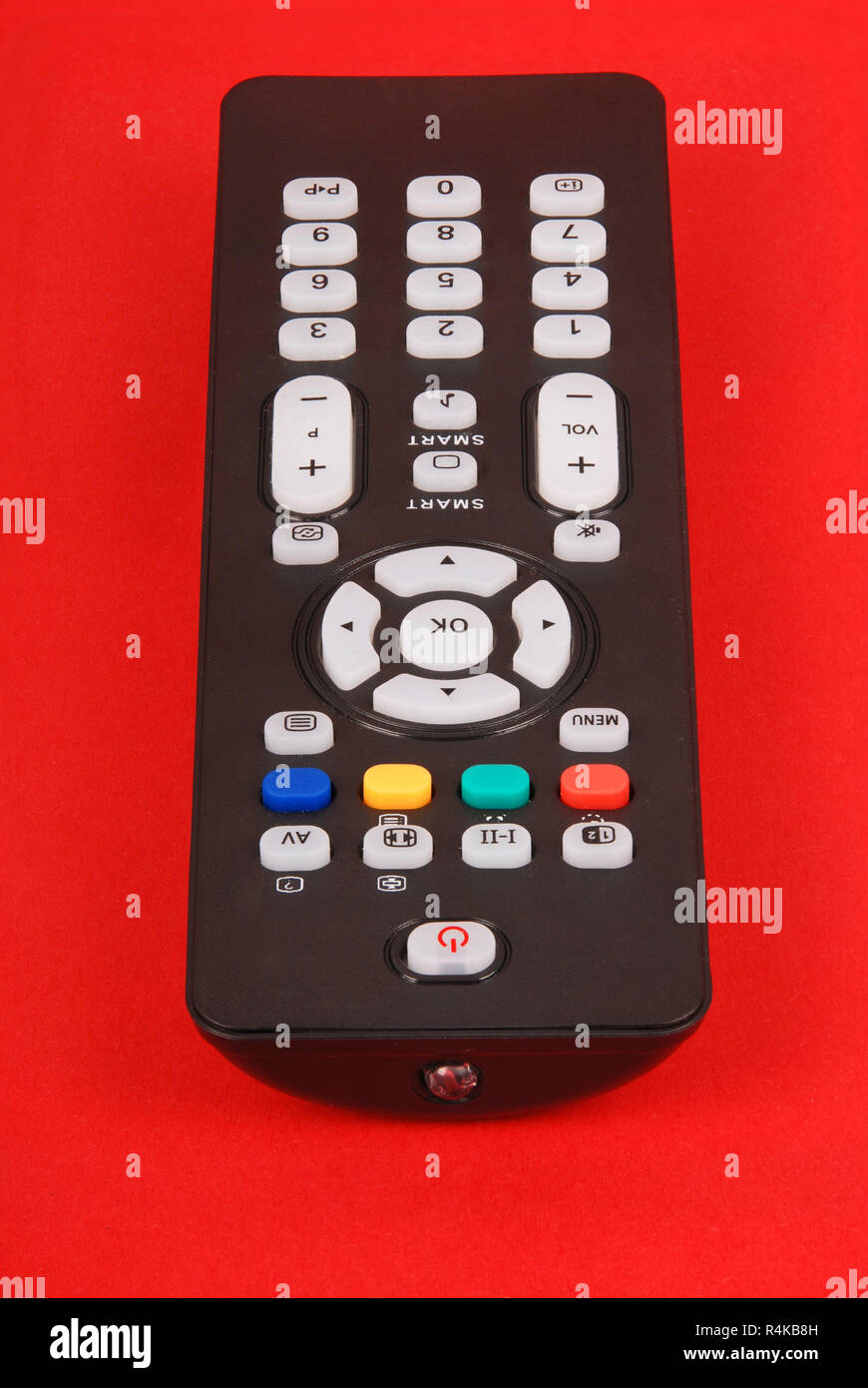 Black remote control for TV isolated on red background Stock Photo