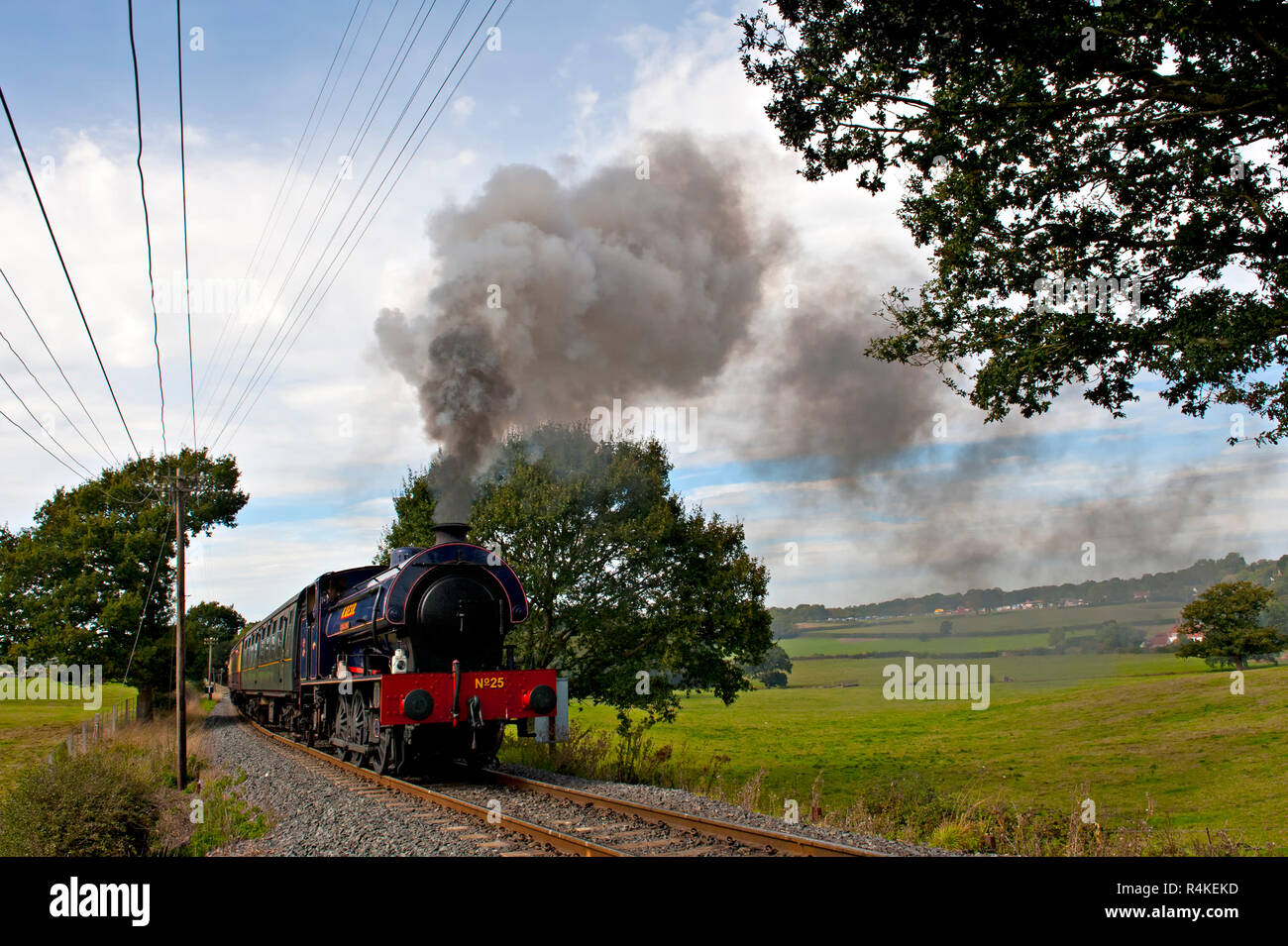 Austerity saddle tank 0-6-0 steam locomotive hauls a train up the steam ...