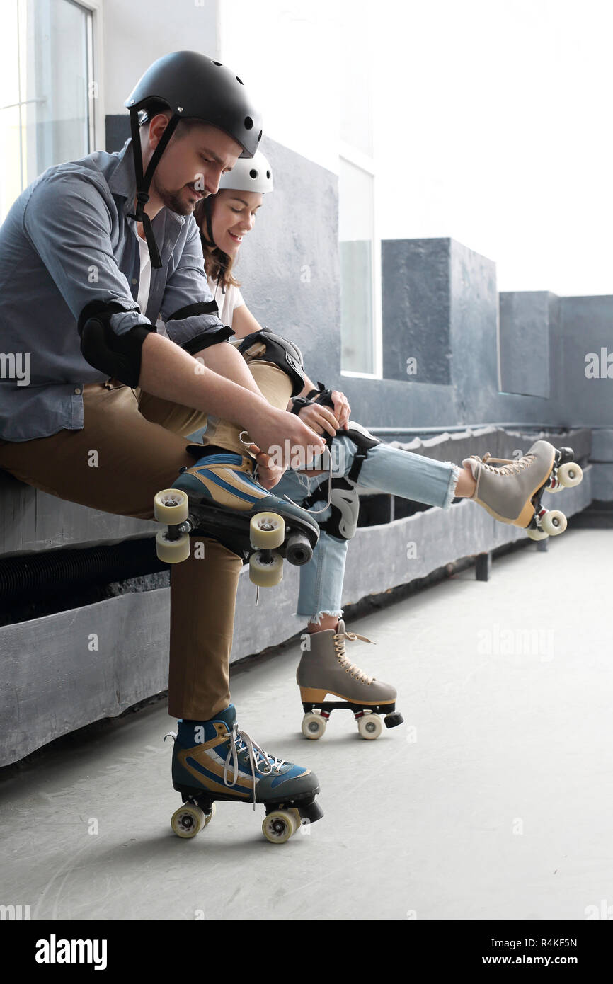 roller skates. woman on roller skates. rollerskating helmet,head  protection. young people riding on roller skates pads and knee pads Stock  Photo - Alamy