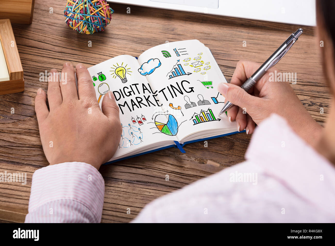 Businessperson Drawing Digital Marketing Concept On Notebook Stock