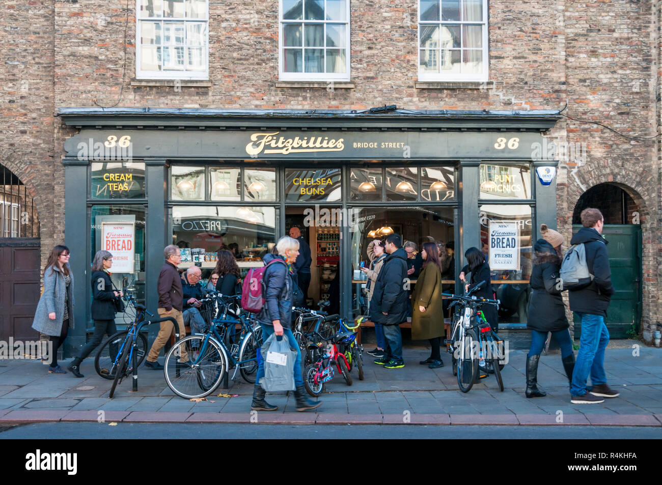Bicycles and people outside Fitzbillies in Bridge Street, Cambridge. Stock Photo