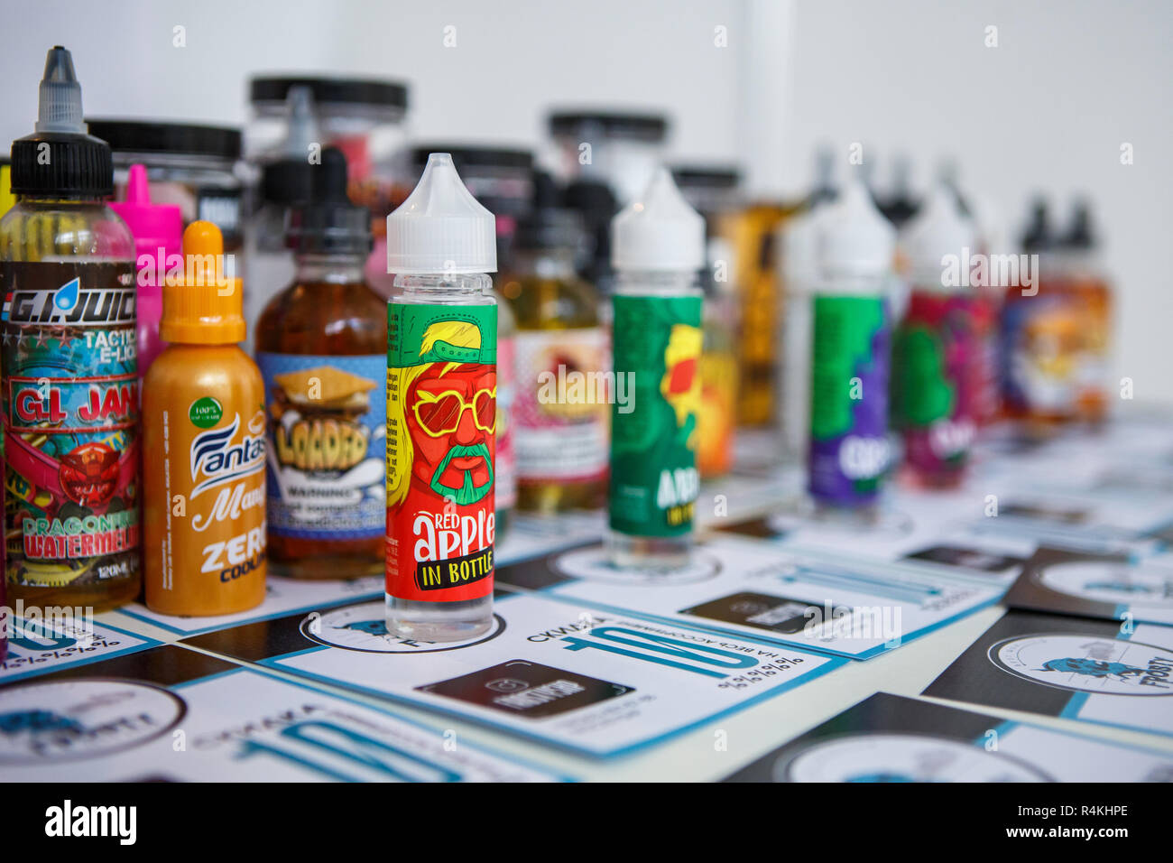 KIEV,UKRAINE-27 OCTOBER,2018: Plastic bottles with e-liquids for smoking tobacco with tasty fresh flavor.Buy new bottle with vape juice,quit smoking n Stock Photo
