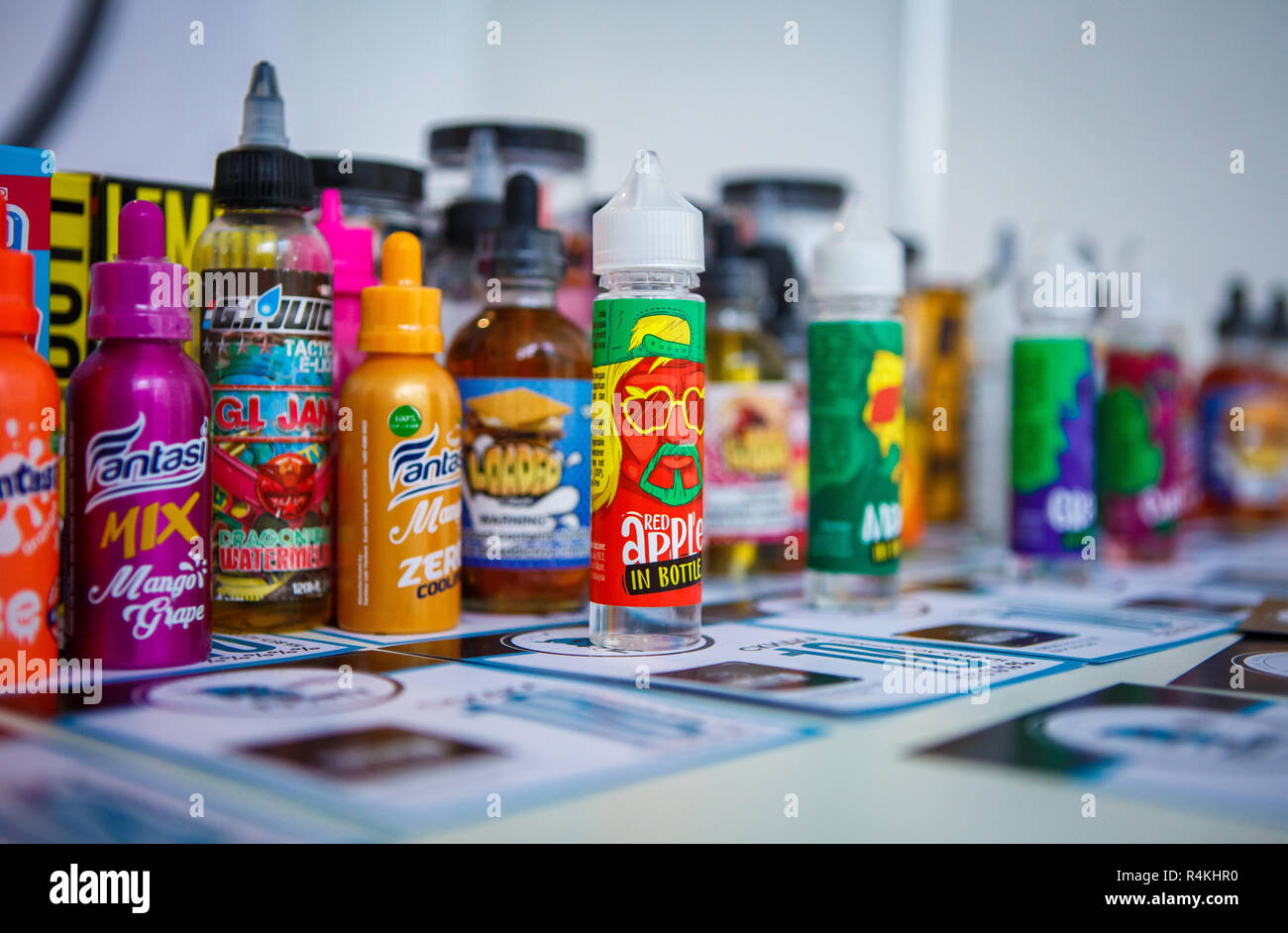 KIEV,UKRAINE-27 OCTOBER,2018: Buy new vape juice liquid at Vape Expo store. Colorful plastic container with e-liquid on sale in shop. Bottles with e-j Stock Photo