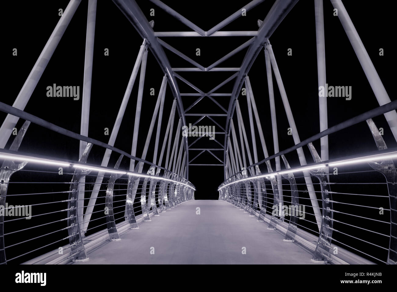 Night time shot of the Sam Thompson Bridge leading from Belfast Harbour Estate to Victoria Park. Stock Photo