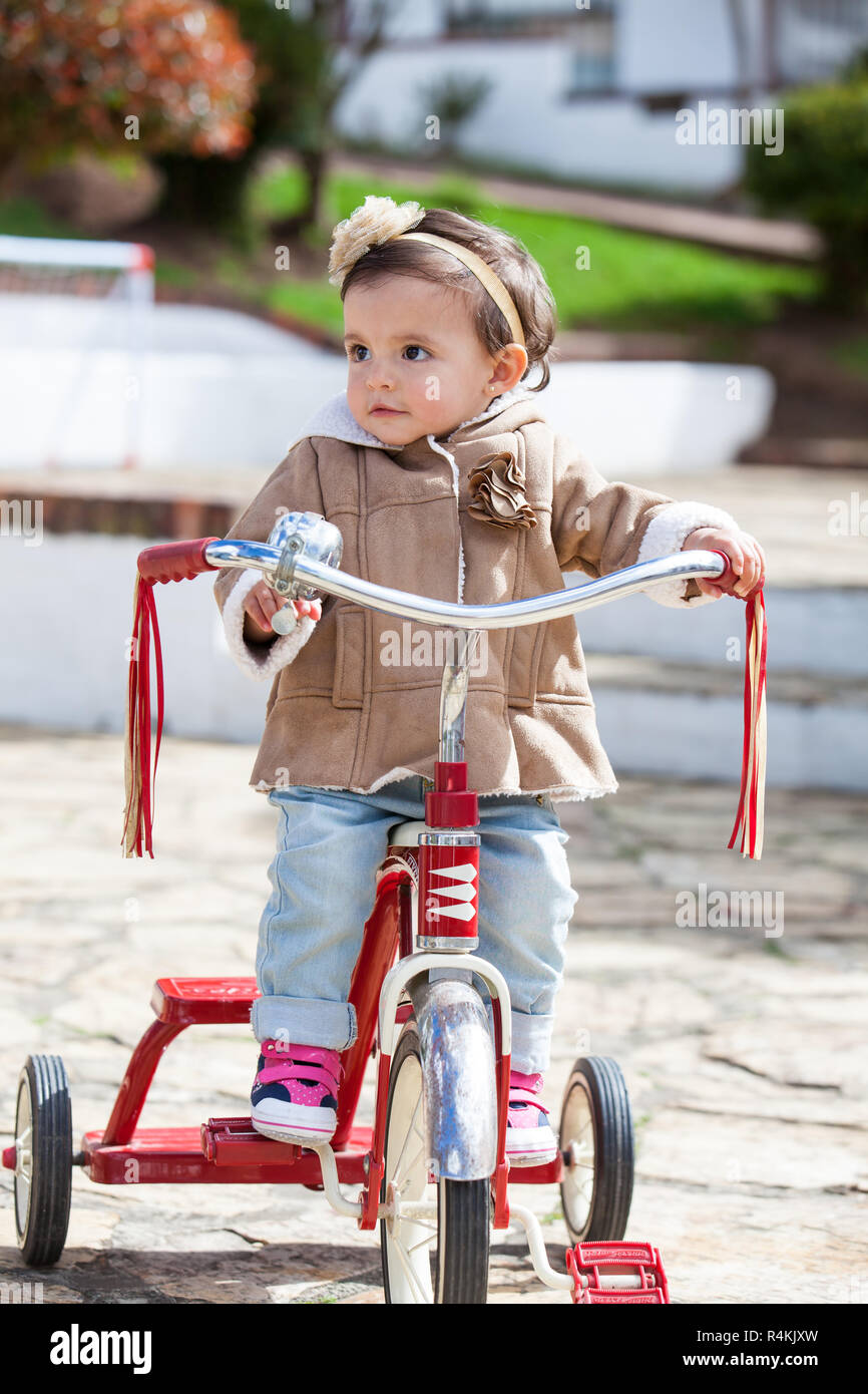 Learning to ride a tricycle Stock Photo Alamy