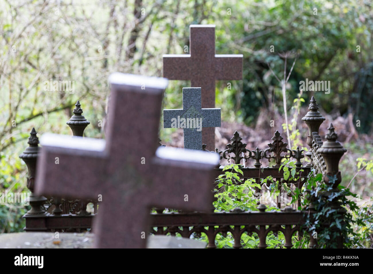 Three crosses in graveyard Stock Photo