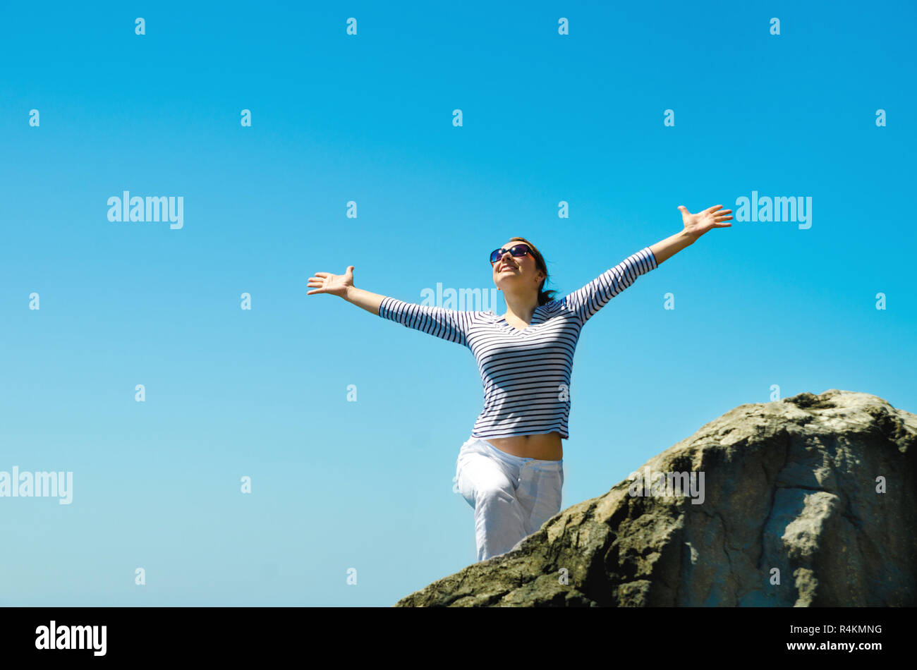 Woman standing at mountain hi-res stock photography and images - Alamy