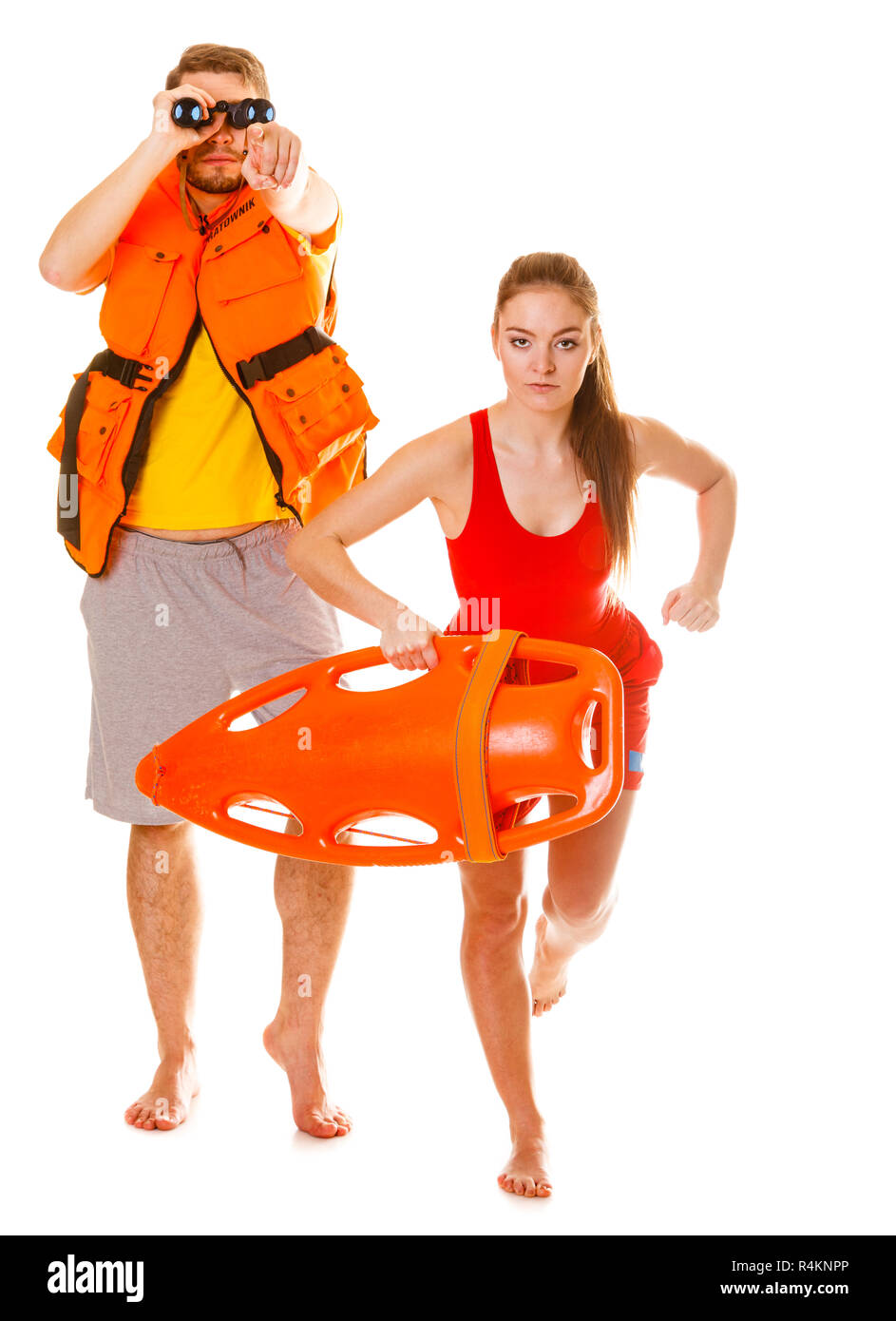 Lifeguards with rescue tube buoy and life vest jacket looking through