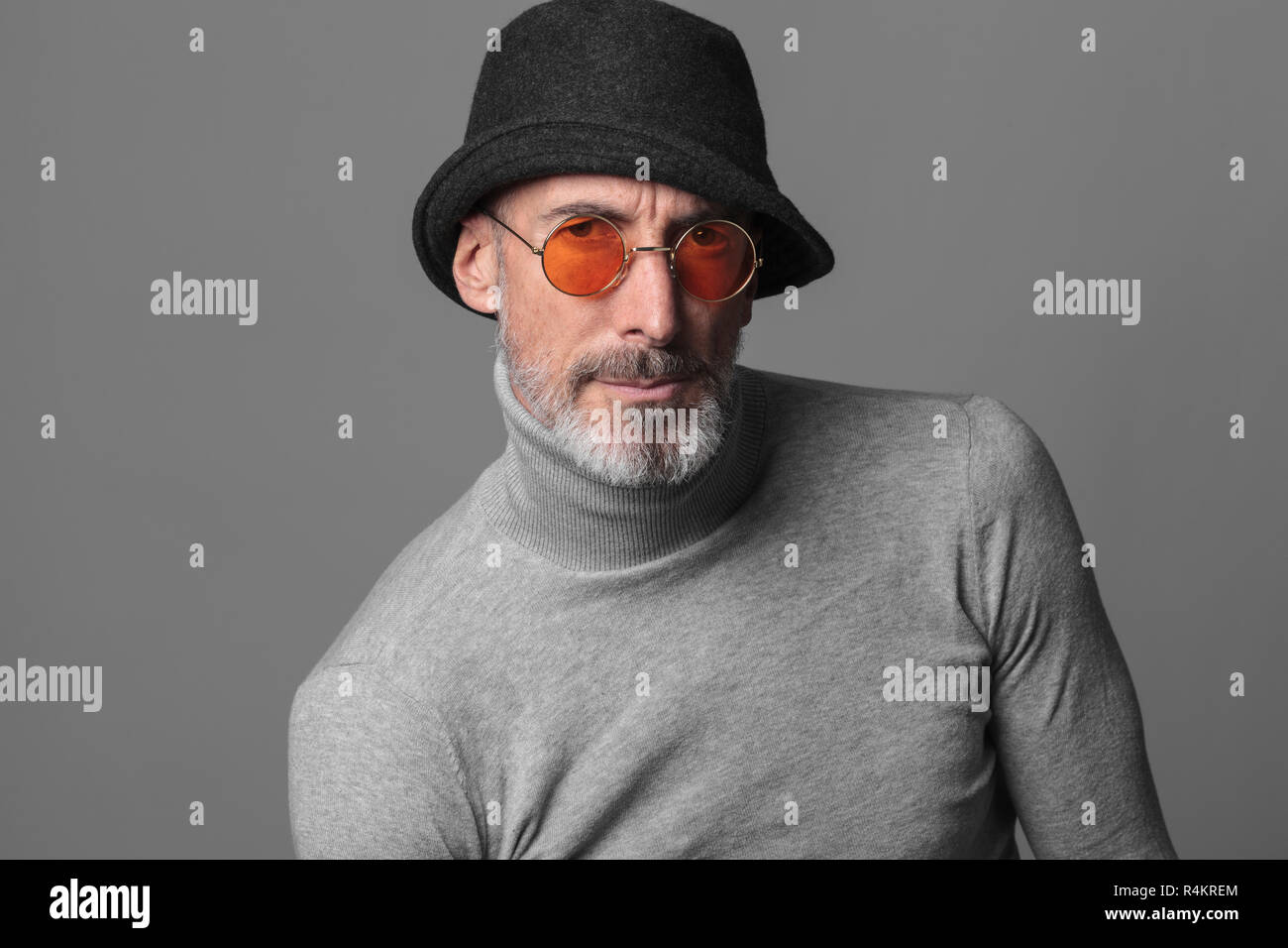Studio portrait of actor and model Stefano Pasianot. Grey background. Stock Photo