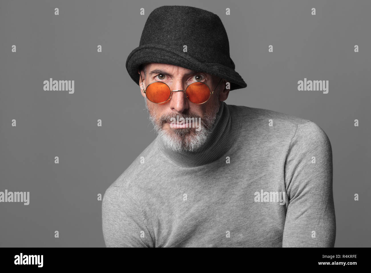Studio portrait of actor and model Stefano Pasianot. Grey background. Stock Photo