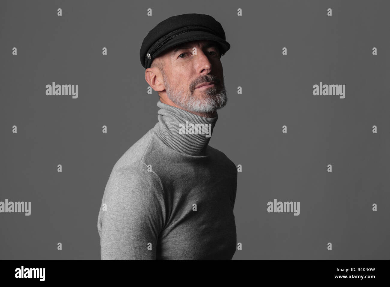 Studio portrait of actor and model Stefano Pasianot. Grey background. Stock Photo