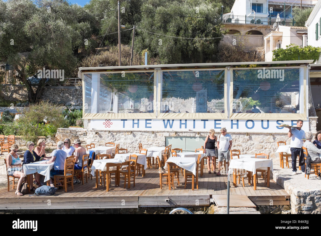 Outdoor cafe at the Durrell Family White House in the pretty coastal village of Kalami in Corfu Stock Photo