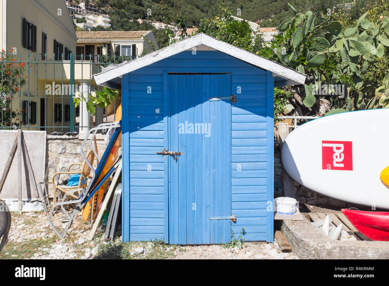 Small blue beach hut on the beach at Kalami in Corfu Stock Photo