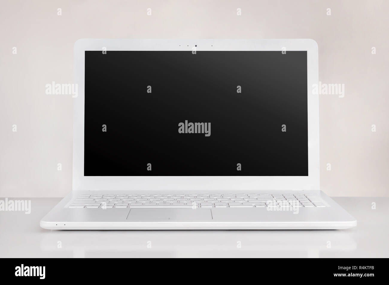totally white laptop with black screen. pure workspace tech concept Stock Photo Alamy
