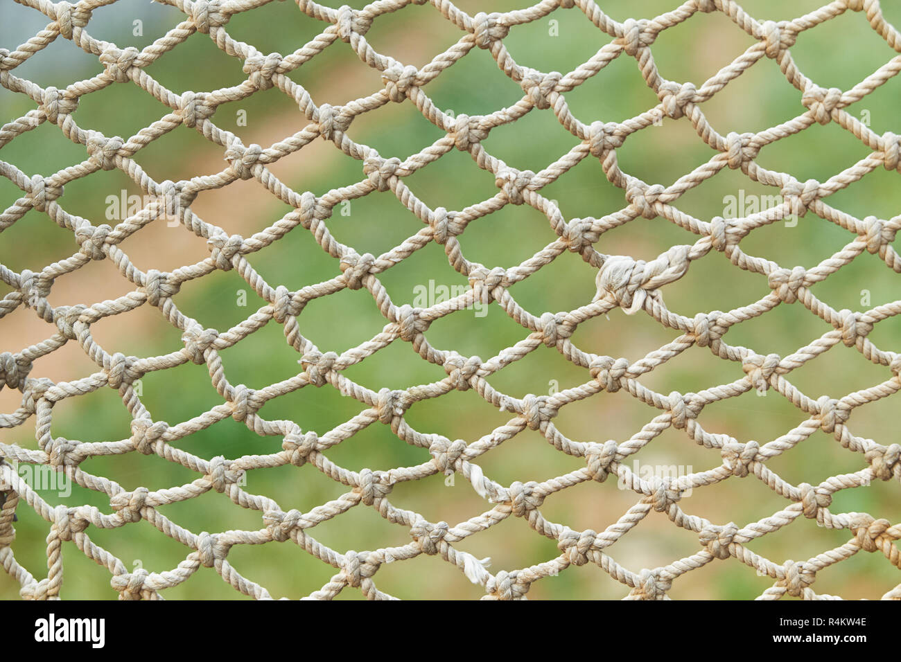 white vintage rope net texture is on green grass background