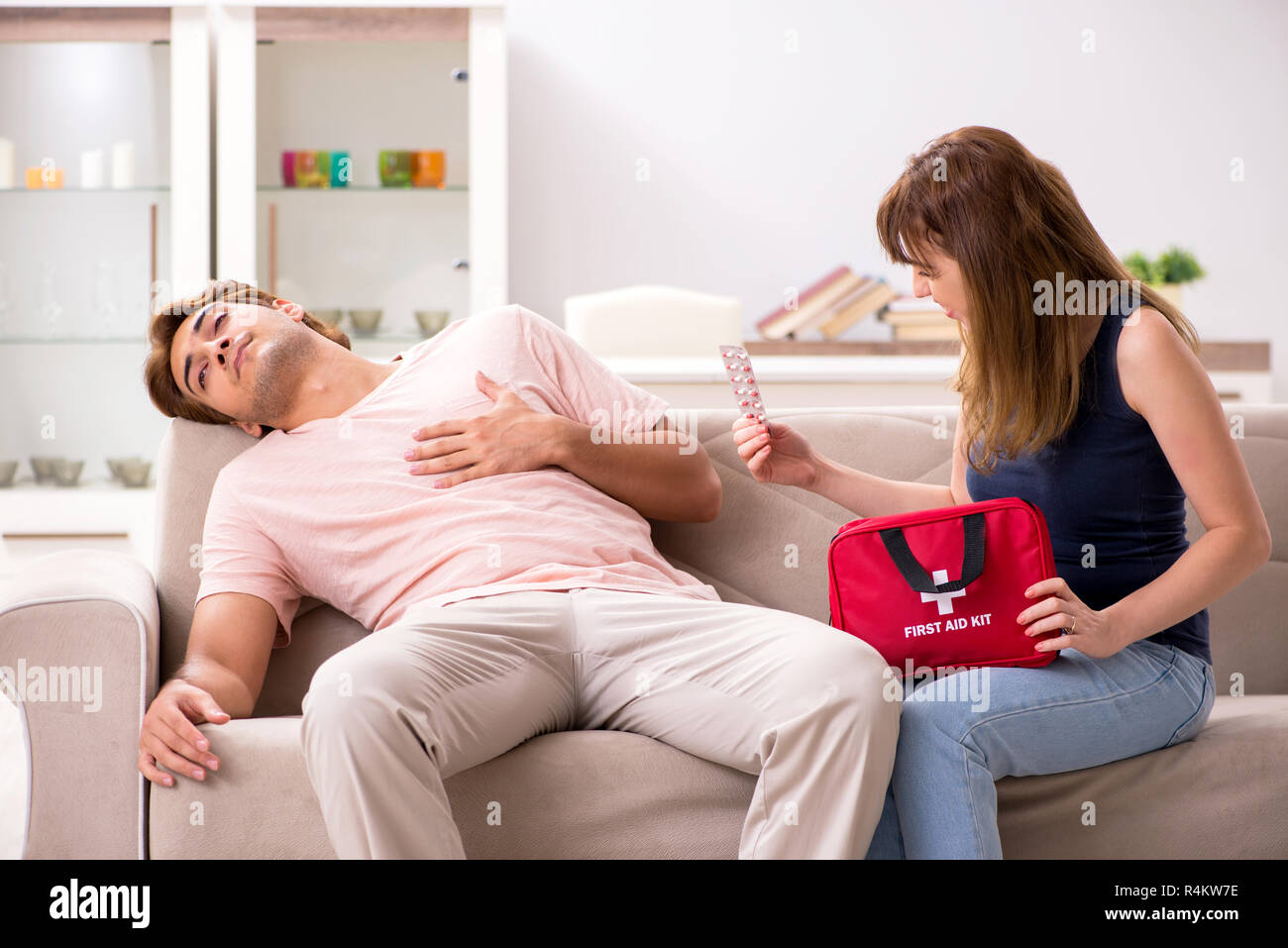 Young family getting treatment with first aid kit Stock Photo Alamy