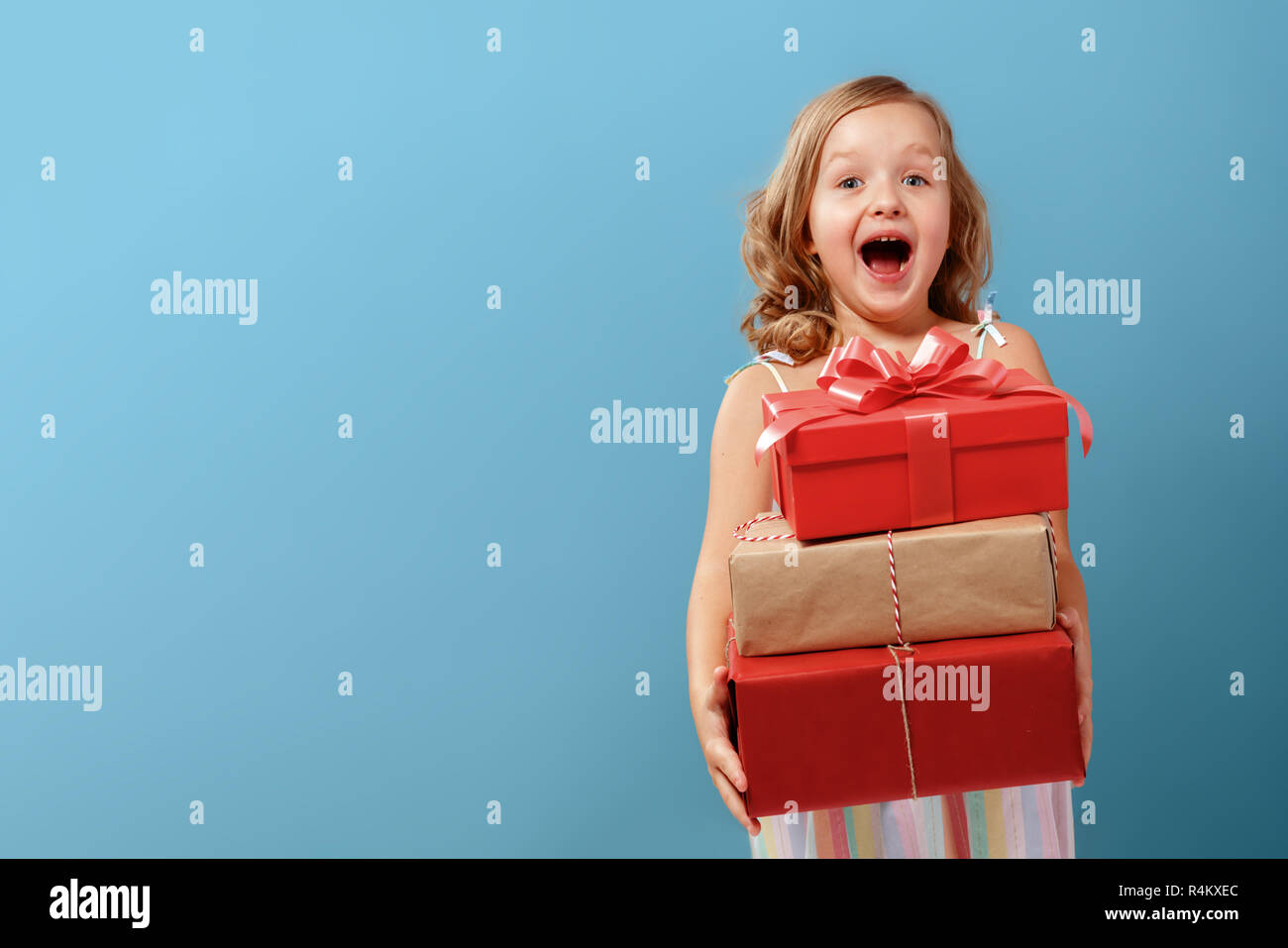 Child receiving gift hires stock photography and images Alamy