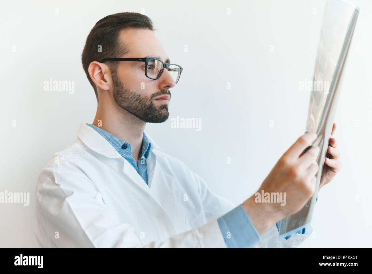 young doctor looking at Magnetic resonance imaging shot of knee-joint. meniscus injury mri xray Stock Photo