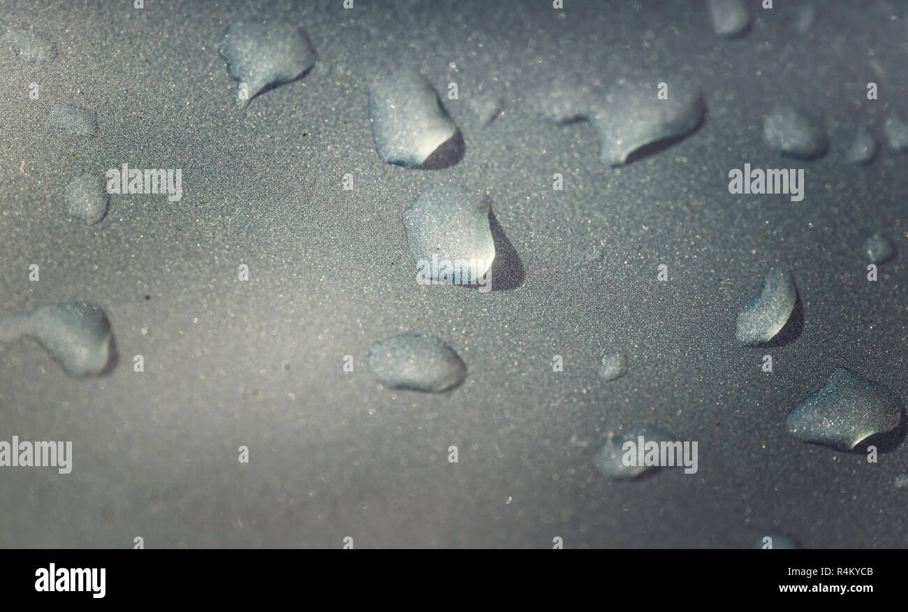 Water drops on metallic gray background in horizontal format Stock Photo