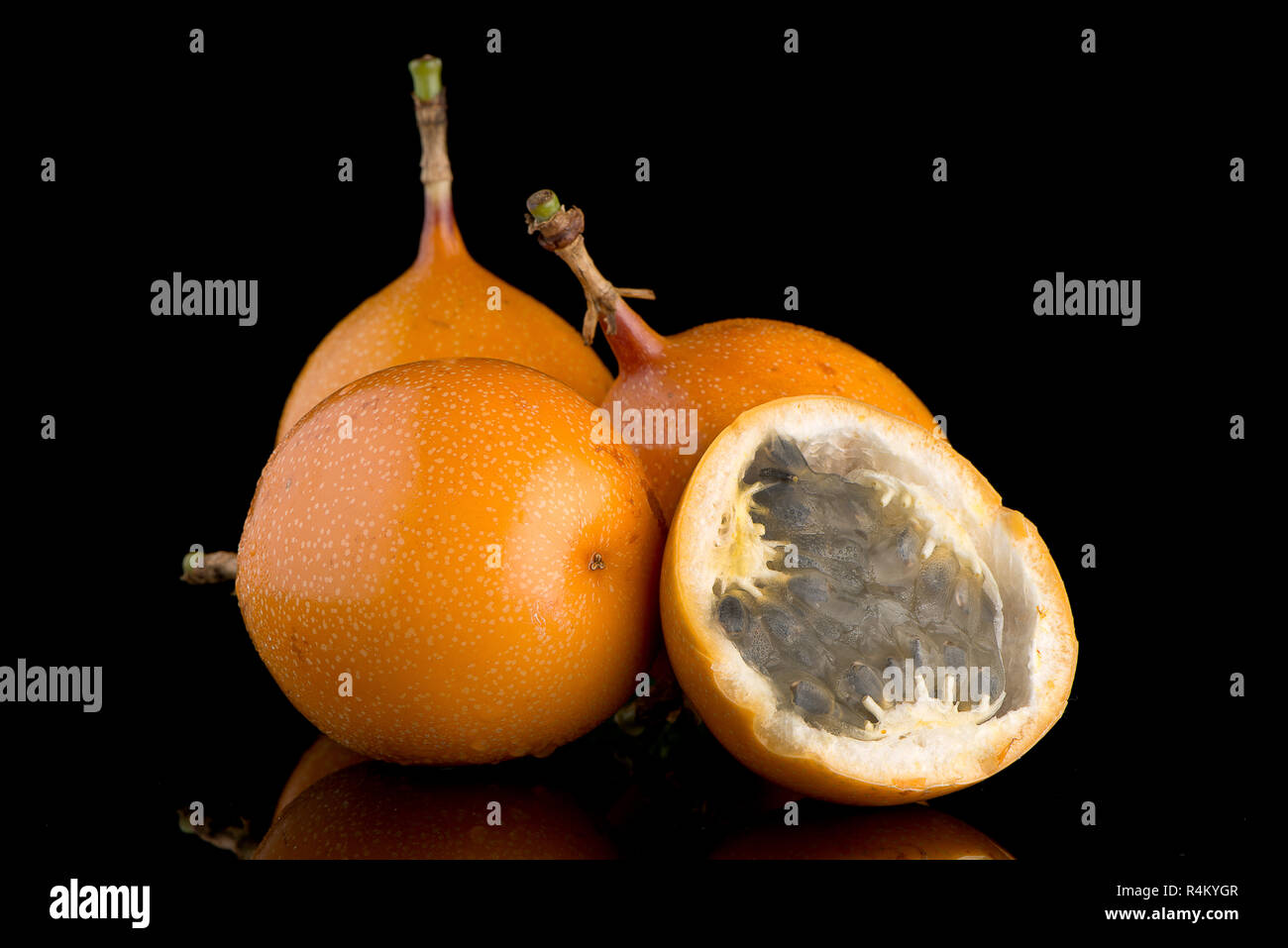 Passion fruit maracuja granadilla on black background Stock Photo - Alamy