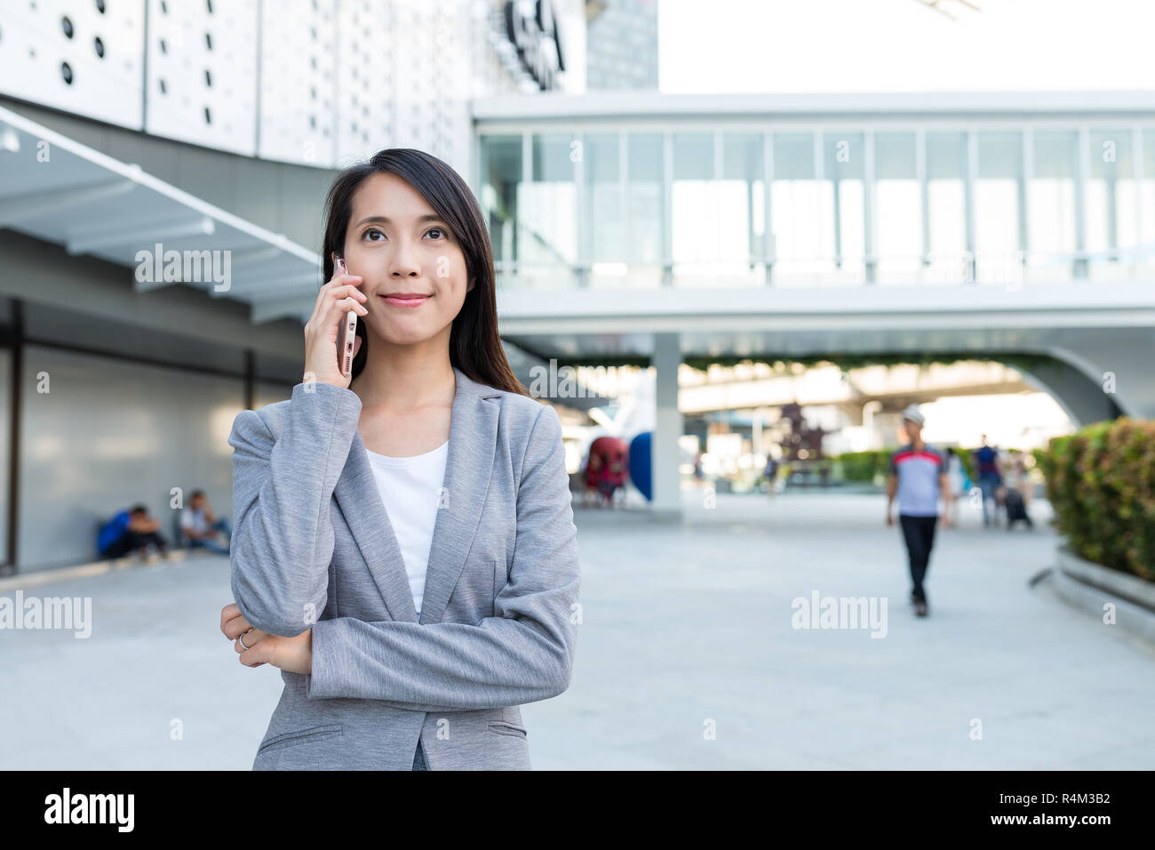 Business woman talk to cellphone at outdoor Stock Photo - Alamy