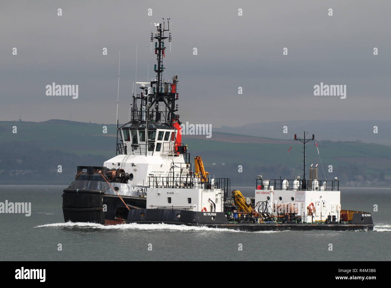 Serco Marine Services' tugboat SD Impetus, with the oiler barge SD