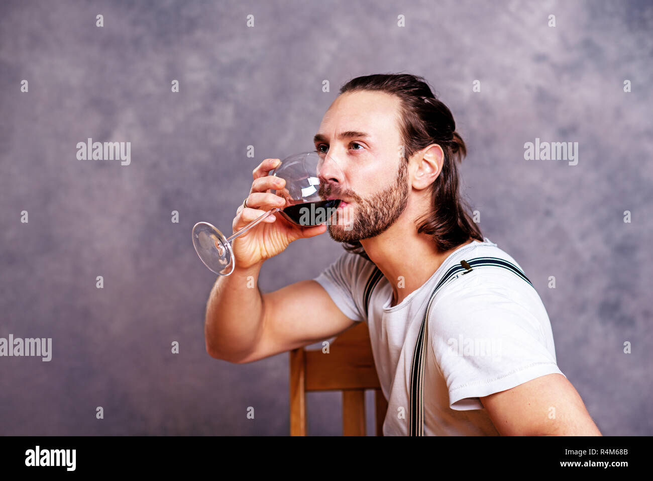 young man drinking red wine Stock Photo - Alamy