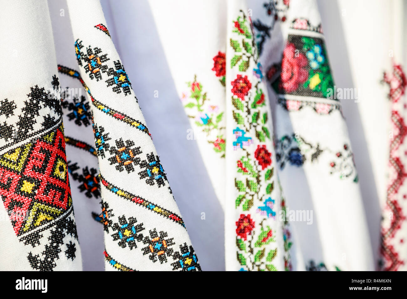 Close-up Romanian traditional embroidery on costumes. Close up of traditional Ie Romanian clothing. Stock Photo