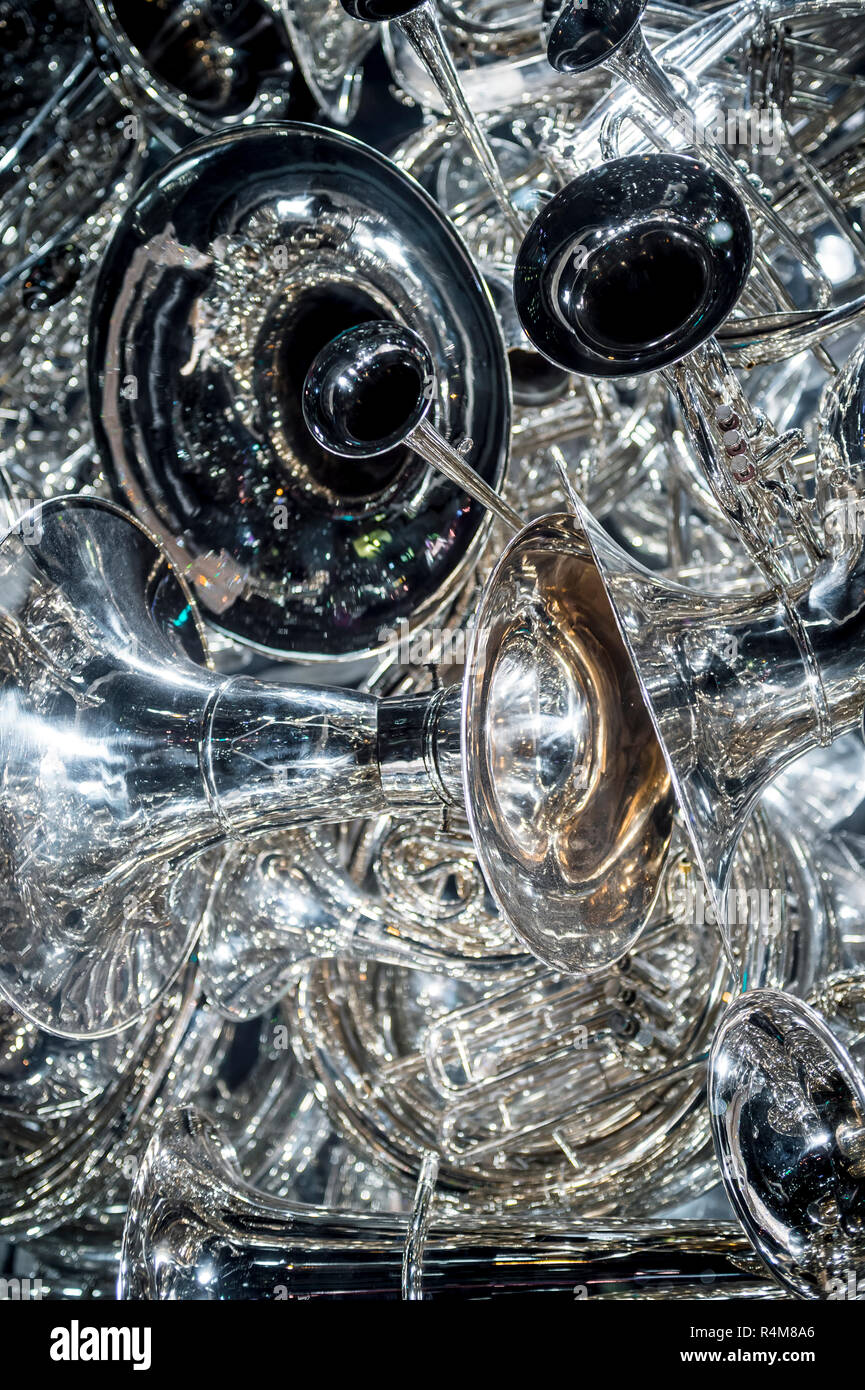 Shiny musical instruments from the horn section in a close up abstract textured background Stock Photo