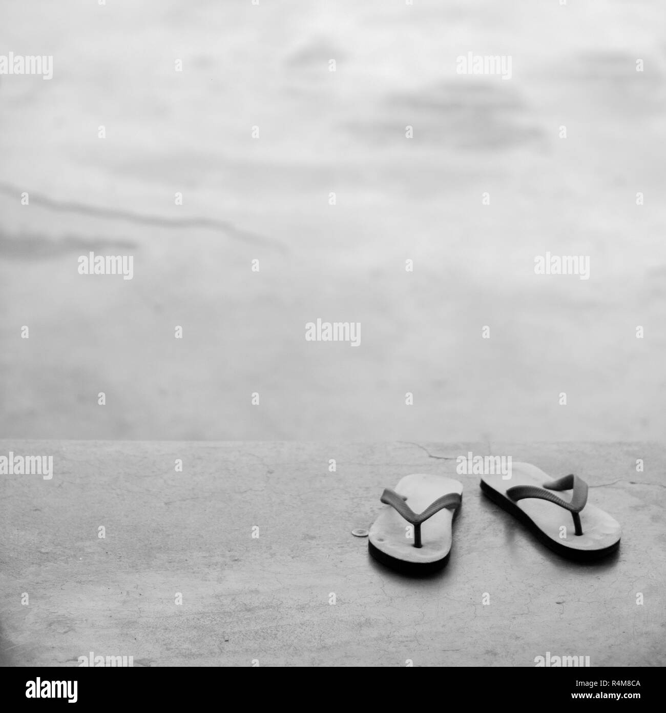 Pair flip flops Black and White Stock Photos Images Alamy