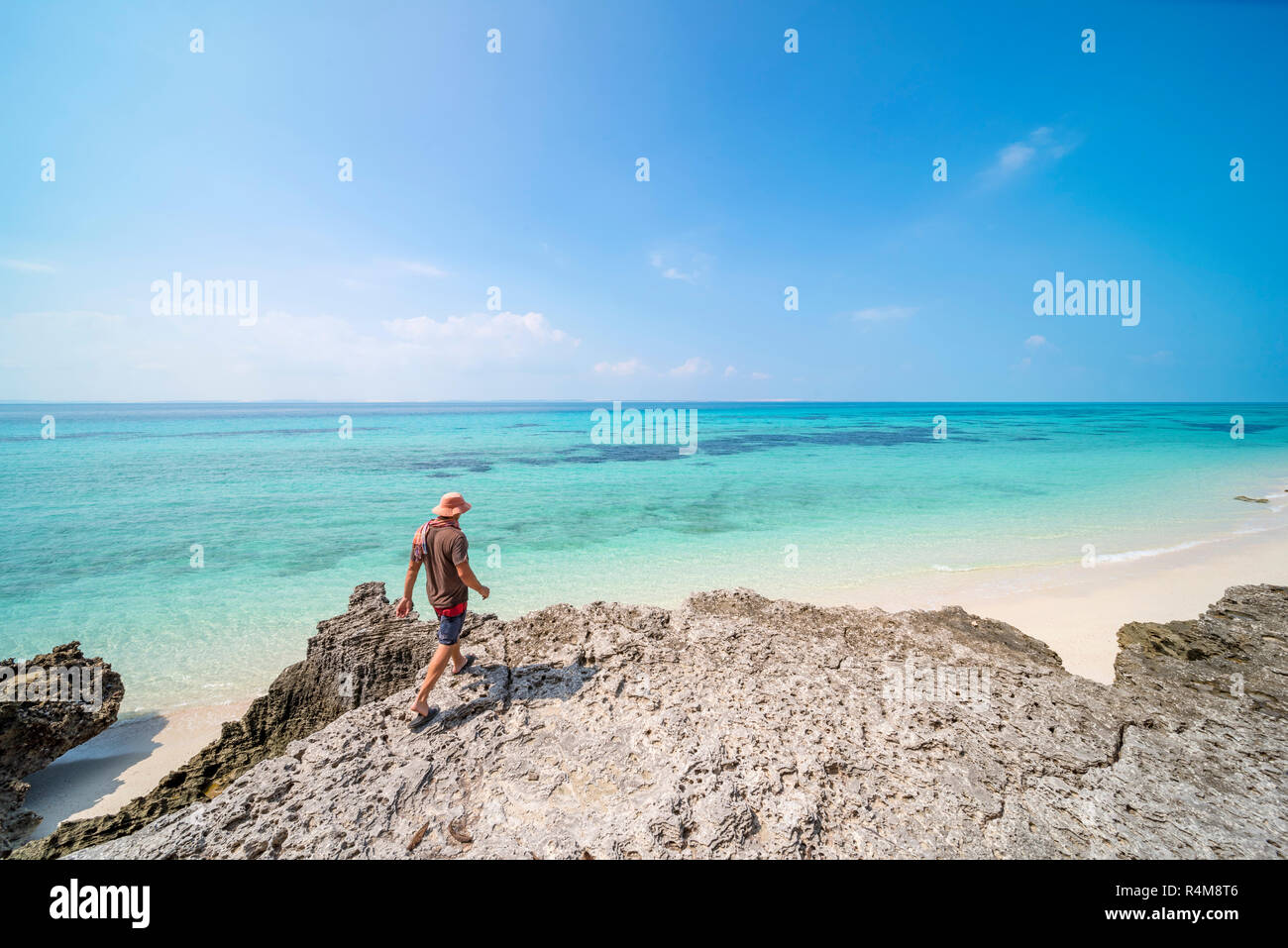 A tourist explores Santa Carolina Island, Bazaruto archipelago Mozambique. Stock Photo