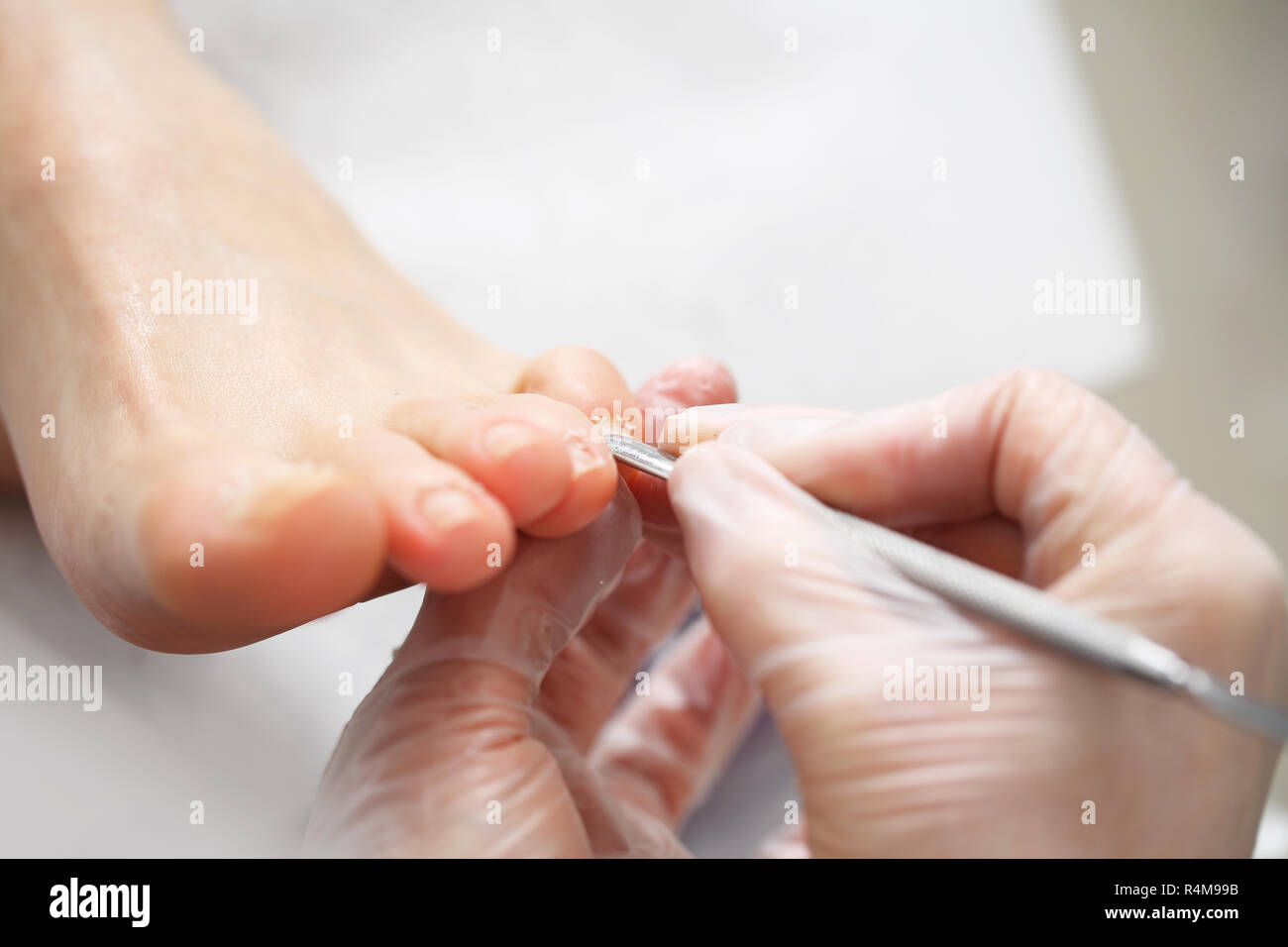nail cleaning in the beauty salon pedicure. nail clipping at the feet