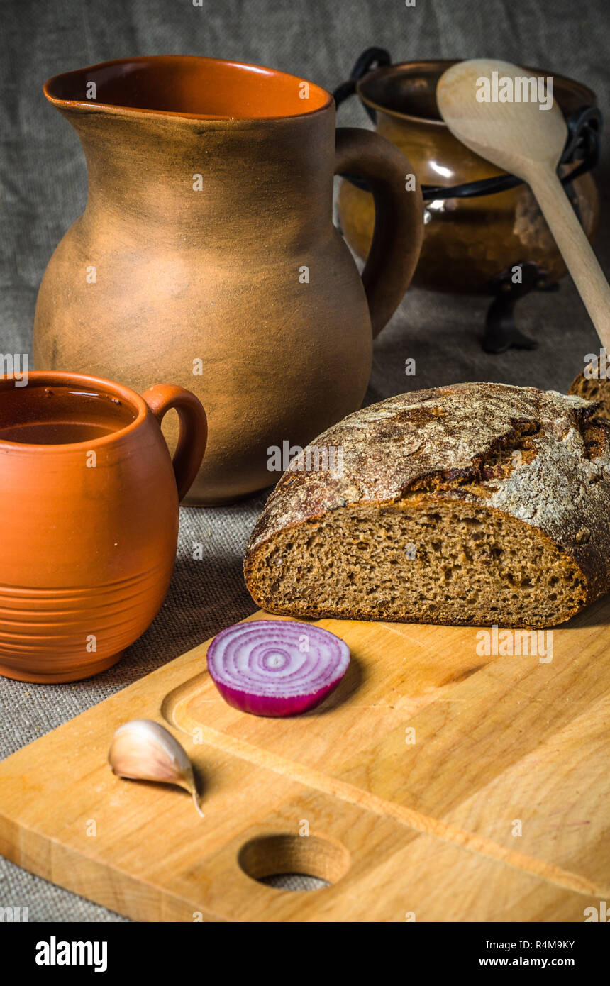 Still life with homemade bread and pottery Stock Photo