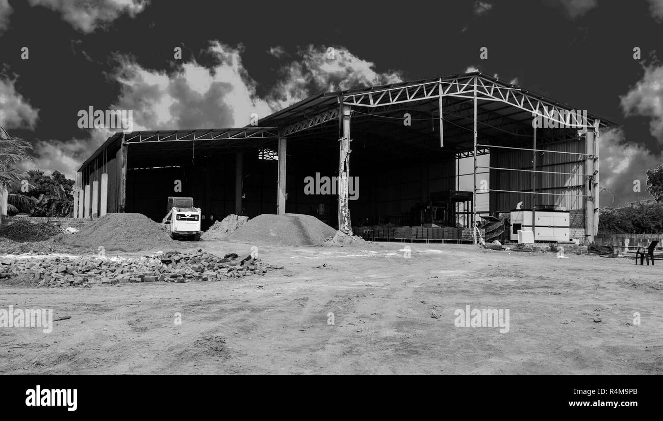 A small scale cement brick industry, black and white Stock Photo Alamy