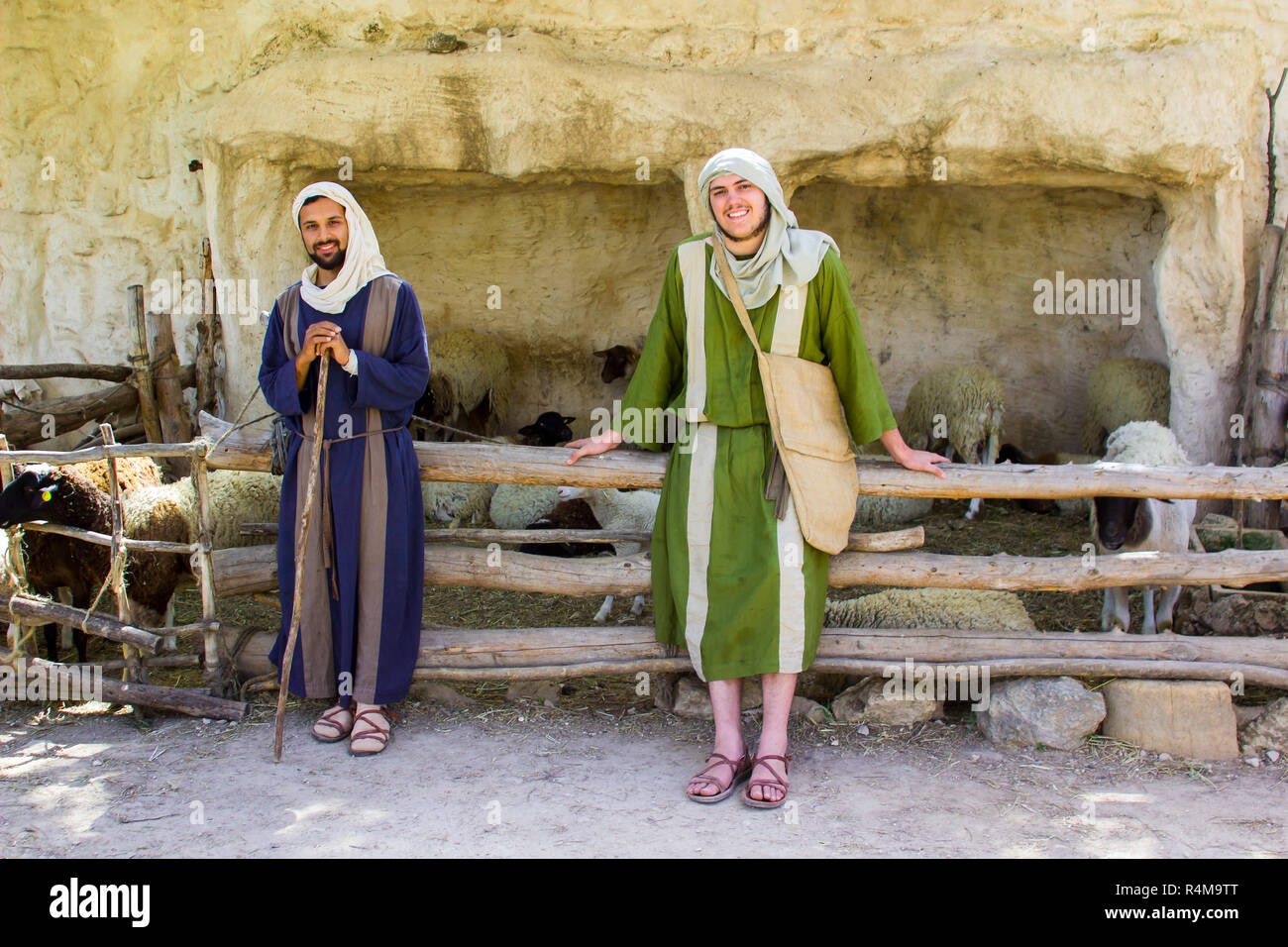 Young men in period dress at the  sheep pen in 1st century Nazareth Village Museum in Israel. This village experience is designed to give the vistor a Stock Photo