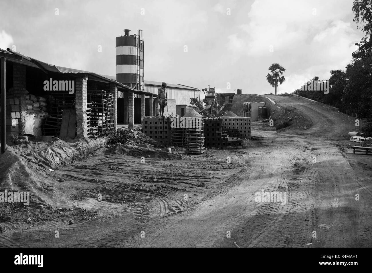 Exterior view of a cement factory. water spray in Cement Brick Stock