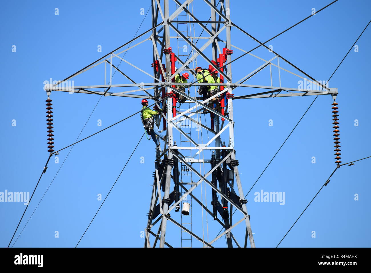 Workers on the high tension transmission lines performing Hoover Dam