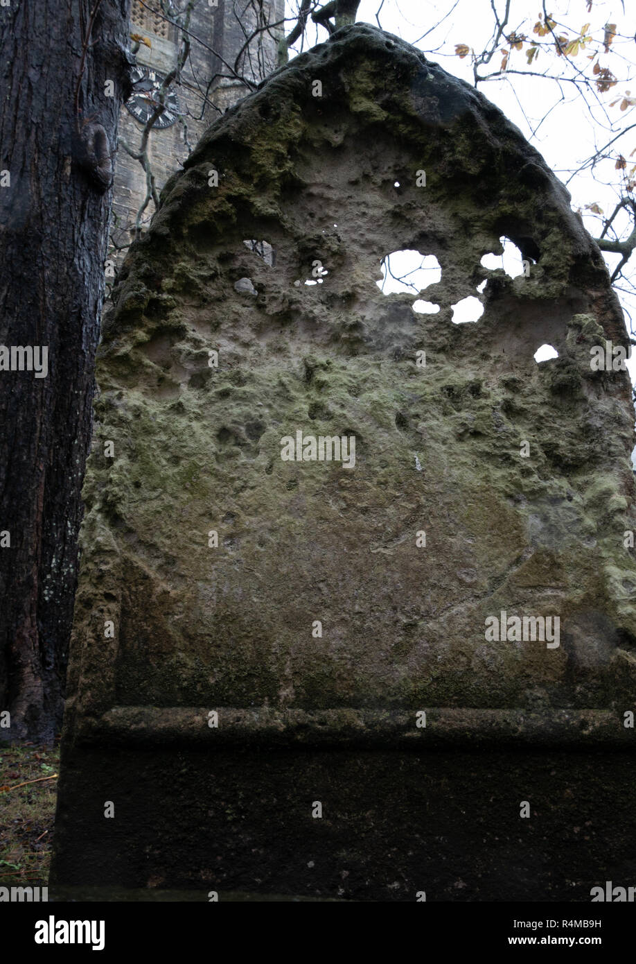 Eroded gravestone, St Giles & St Nicholas' Church, Sidmouth, Devon, UK Stock Photo