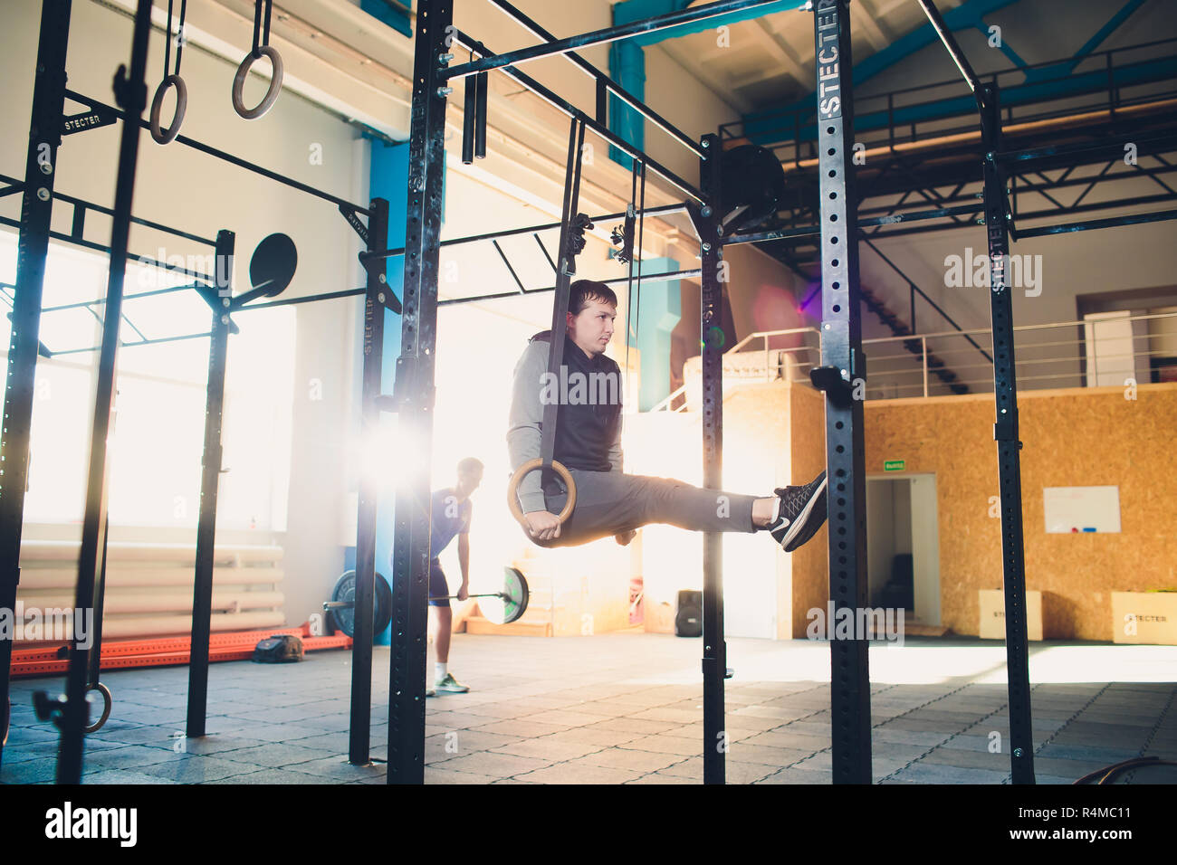 Muscle Up Exercise Athletic Man Doing Intense Workout At The Muscle Up Exercise Athletic Man Doing Intense Workout At The