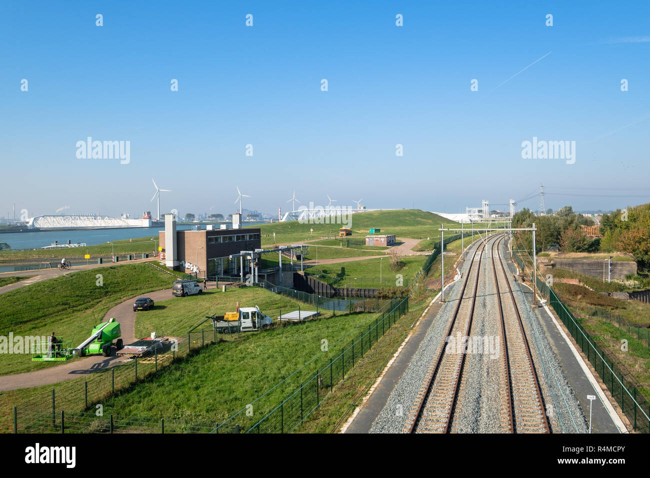 Pumping station, railway and the canal, the waterway from the North Sea towards the harbor of Rotterdam Stock Photo