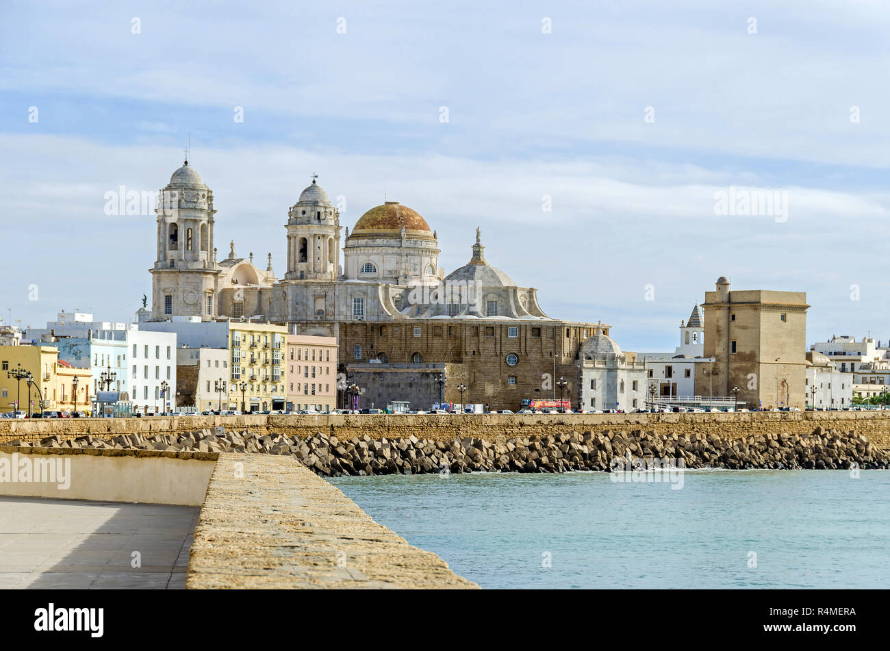 Waterfront promenade Avenida Campo del Sur and the Cadiz Cathedral, with its mix of architectural styles - baroque, rococo and neoclassical style Stock Photo