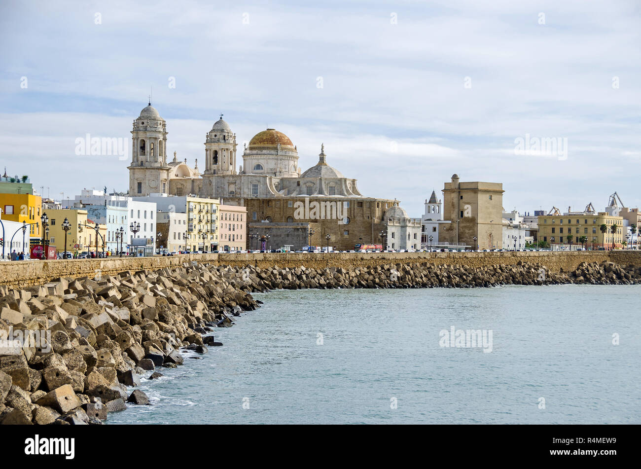 Waterfront promenade Avenida Campo del Sur and the Cadiz Cathedral, with its mix of architectural styles - baroque, rococo and neoclassical style Stock Photo