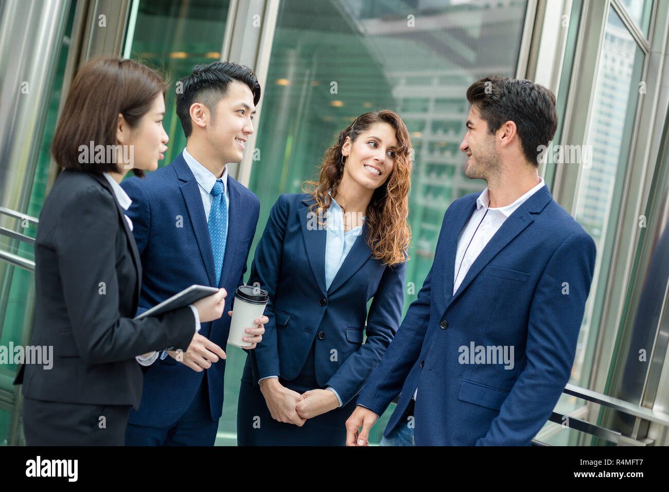 Group of business team talking to each other Stock Photo