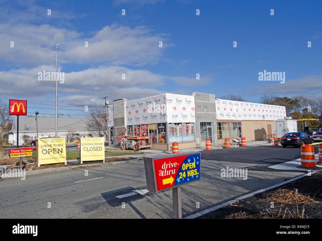 McDonalds fast food restaurant being remodeled with drive thru open and dining room closed signs in Falmouth, Cape Cod, Massachusetts USA Stock Photo