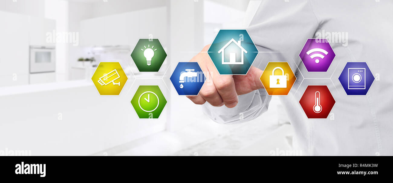 smart home automation control hand touch screen with colored symbols on ...