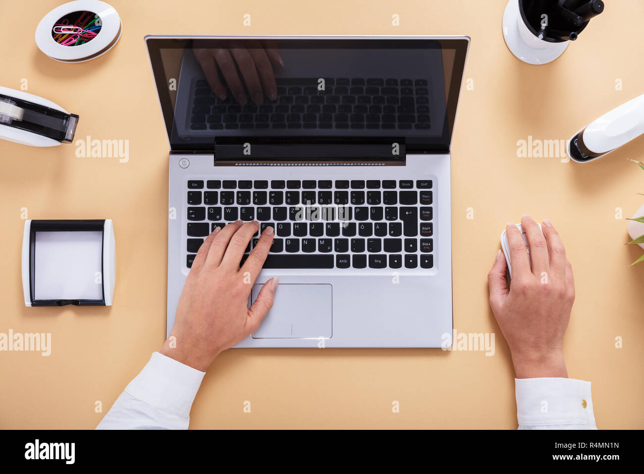 Businesswoman's Hand On Laptop Stock Photo - Alamy