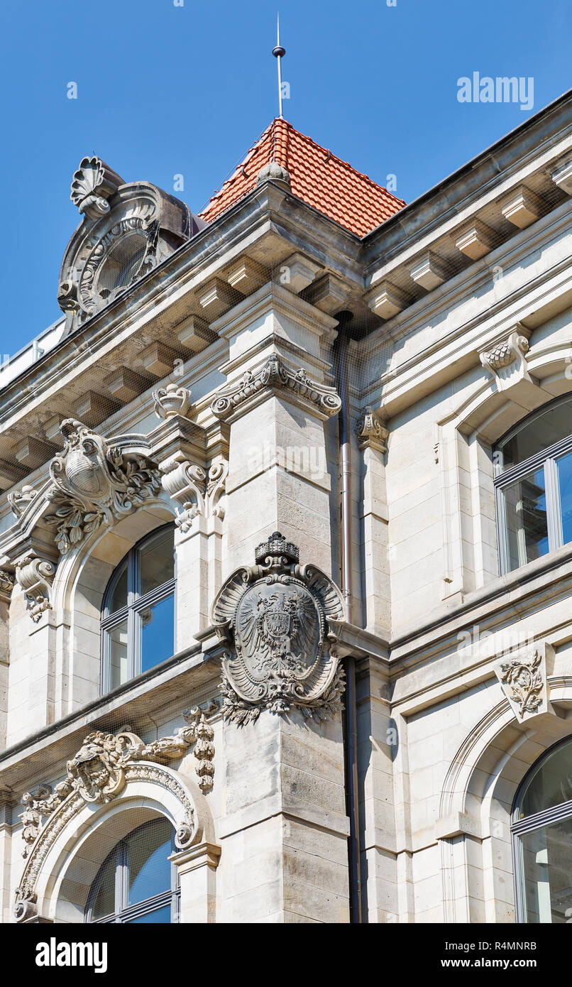 Old beautiful building exterior with coat of arms in Mitte district, Berlin, Germany. Stock Photo