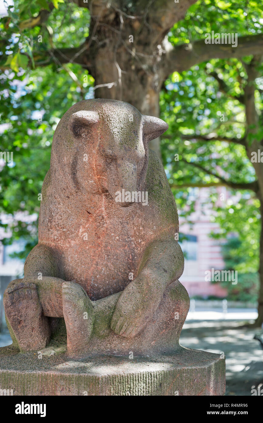 Mother bear statue closeup, Bears fountain or Barenbrunnen close to Friedrichswerder Church. Fountain depicts a family of brown bears, the heraldic sy Stock Photo