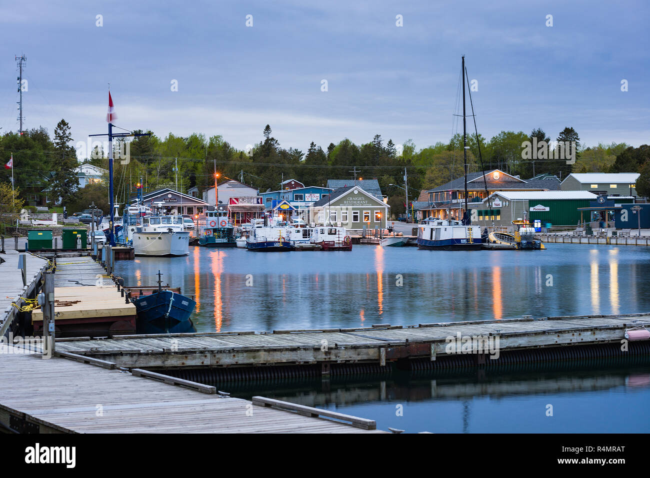 Little Tub Harbour and town of Tobermory at dusk, known as 'fresh water SCUBA diving capital of the world', Ontario, Canada Stock Photo