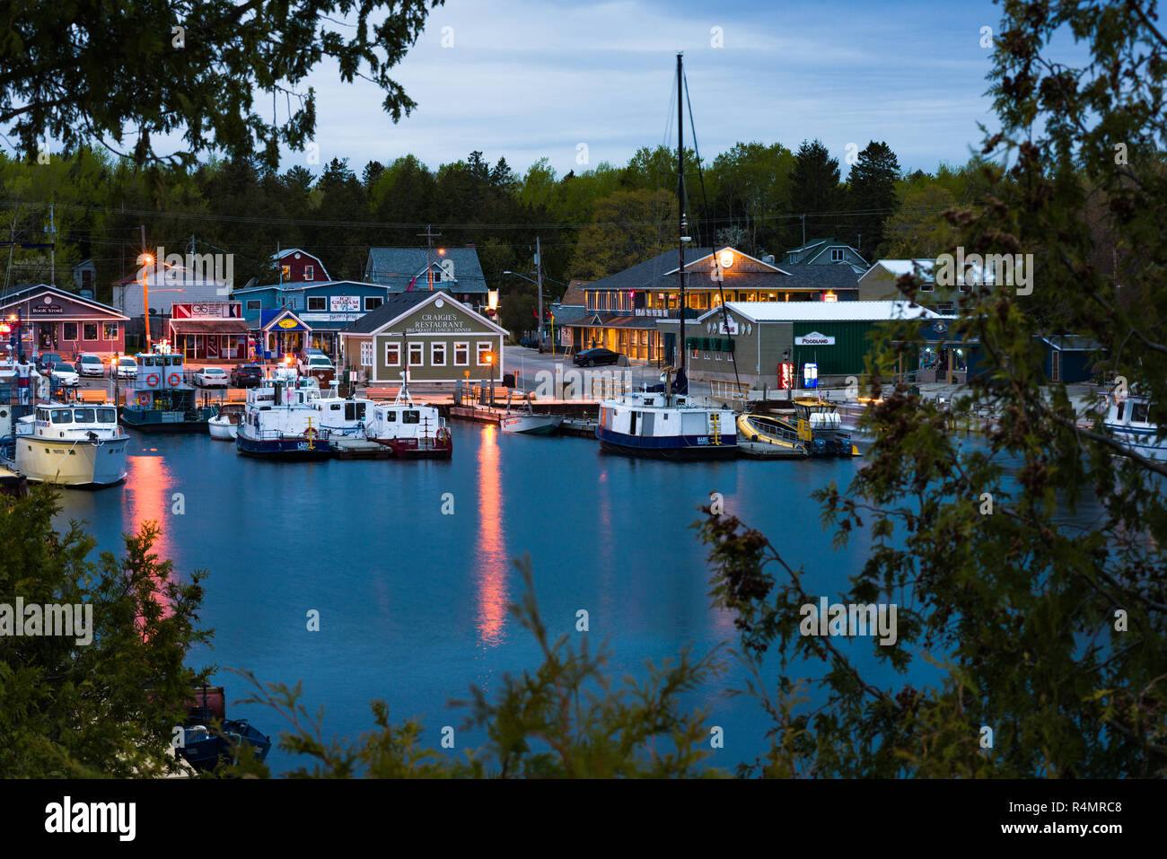 Little Tub Harbour and town of Tobermory at dusk, known as 'fresh water SCUBA diving capital of the world', Ontario, Canada Stock Photo